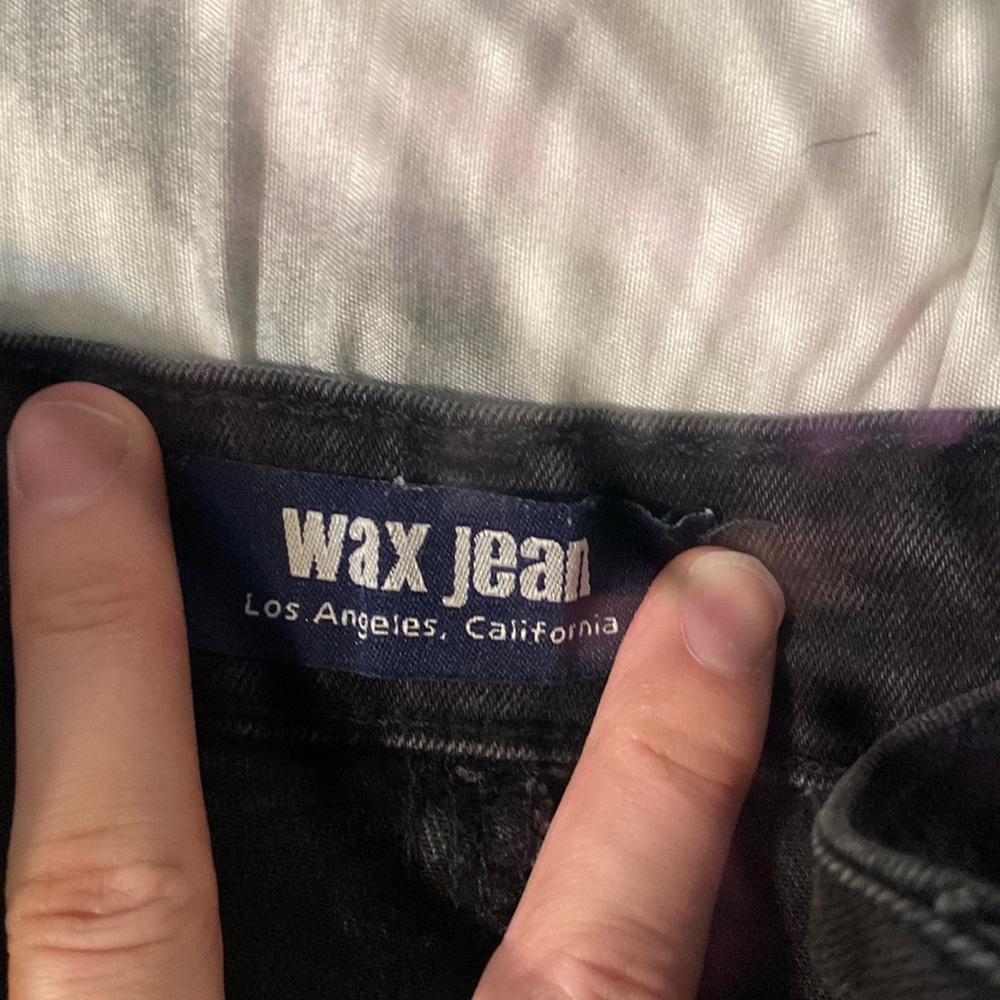 Black jean skirt. Size medium. Worn a couple times good condition